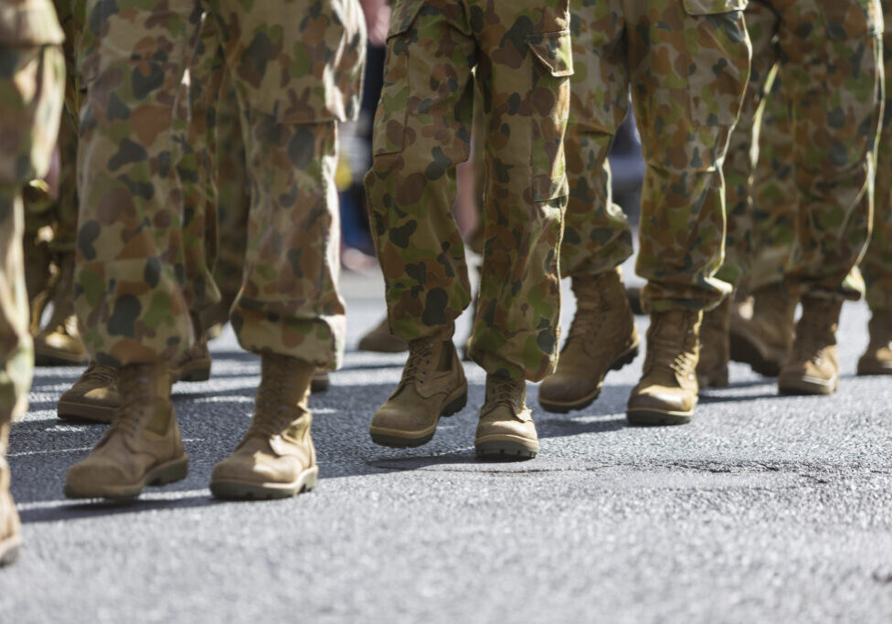 Feet of soldiers marching at an ANZAC Day parade on the streets of a regional country town